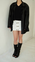 145 / mini skirt with metal eyelet detail